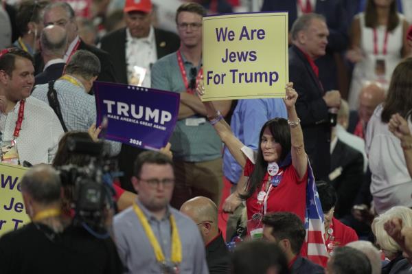 A woman holding up a "We Are Jews For Trump" during the second day of the Republican Natio<em></em>nal Co<em></em>nvention in Milwaukee on July 16, 2024.