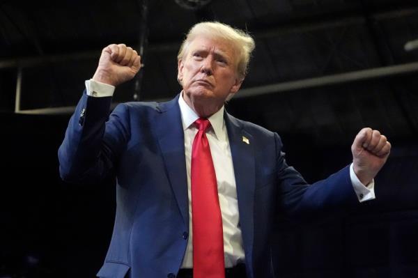 Former President Do<em></em>nald Trump dancing on stage at a campaign rally in Bozeman, Mo<em></em>ntana in 2024