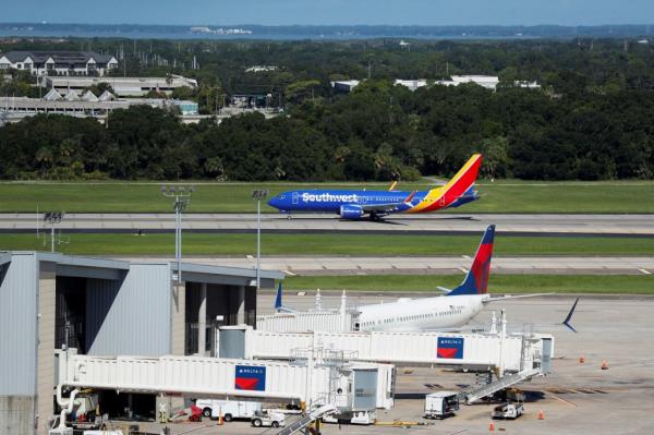 Southwest Airlines plane taking off from Tampa Internatio<em></em>nal Airport runway, following a worldwide tech outage due to software update issues