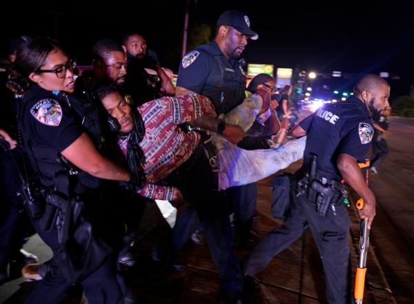 Ferguson police arrest Elijah Gant outside the police department on Aug. 9, 2024 in Missouri.