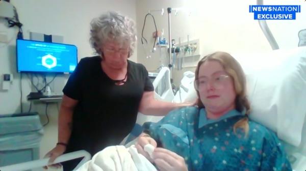 Tessa Trotter in hospital bed alo<em></em>ngside mother talking on NewsNation