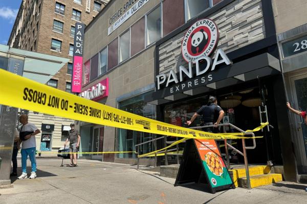 Police at the scene of wher<em></em>e two teen boys were stabbed inside a Panda Express restaurant in Manhattan on Aug. 10, 2024.