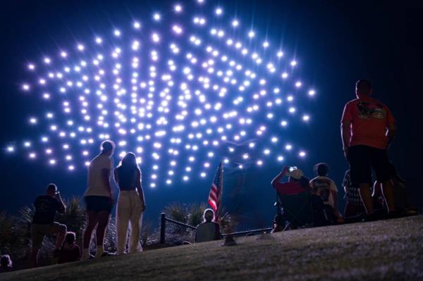 Thousands of people attending an Independence Day celebration at the Paradise Coast Sports Complex in Naples, Fla., with a drone light show replacing the usual fireworks display.