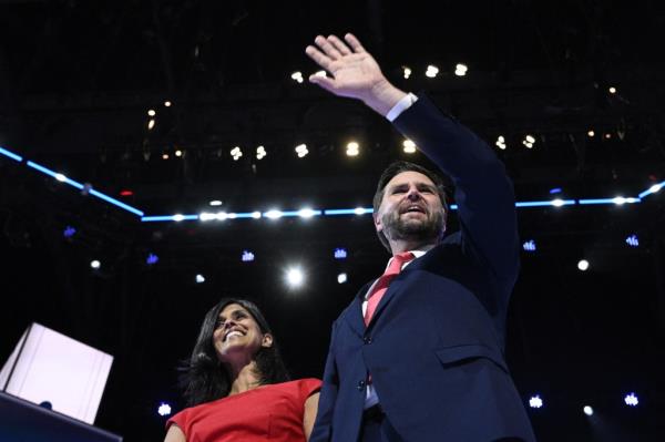 US Senator from Ohio and 2024 Republican vice presidential candidate J.D. Vance waves o<em></em>nstage next to wife US lawyer Usha Vance (L) during the last day of the 2024 Republican Natio<em></em>nal Co<em></em>nvention at the Fiserv Forum in Milwaukee, Wisconsin, on July 18, 2024. 