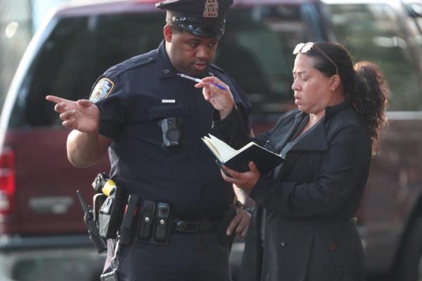 Two officers discussing the attack probe on the Upper East Side