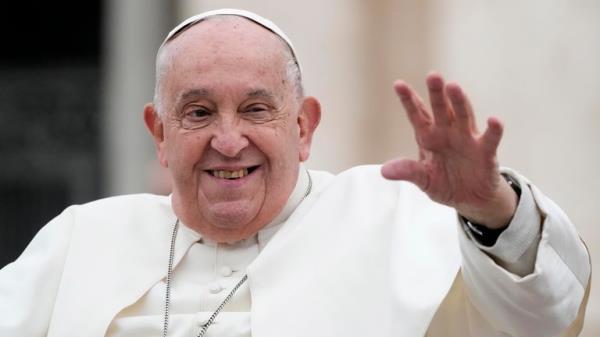 Pope Francis waves as he leaves his weekly general audience in St Peter's Square on Wednesday. 
Pic: AP/Gregorio Borgia